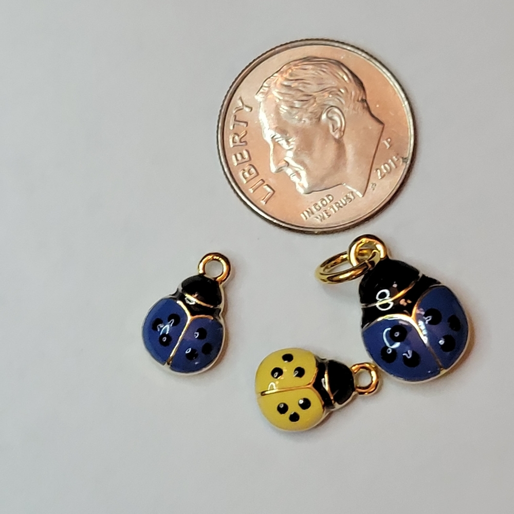 Blue and yellow ladybug charms